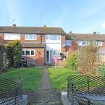 Brick house with garden in suburban area.