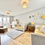 Bright living room with yellow decor and piano.