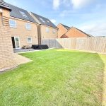 Spacious back garden with well-kept lawn