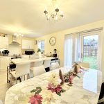 Bright kitchen with festive dining table decor.