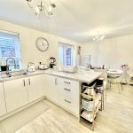 Bright modern kitchen with dining area.