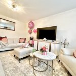 Cosy living room with modern decor and gifts.