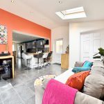 Modern open-plan kitchen and living area design.