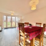 Bright dining room with garden view.