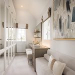 Elegant dressing room with mirrored wardrobes.