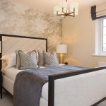 Modern bedroom with stylish decor and lighting.