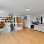Spacious open-plan living room with modern decor.
