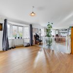 Spacious home interior with wooden flooring