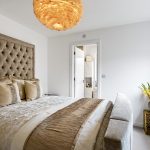 Luxurious bedroom with elegant decor and cosy lighting.