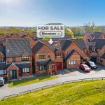 Brick houses for sale in UK neighbourhood.