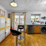 Modern kitchen with wooden cabinets and appliances