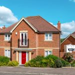 Modern red brick house with garden.