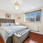 Cosy bedroom with double bed and stylish decor.