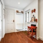 Cosy home entrance with wooden flooring.