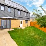 Modern house with garden and solar panels