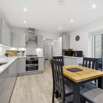 Modern kitchen with dining table and chairs