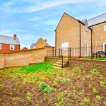 Modern brick house with walled garden and patio