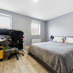 Modern bedroom with desk and chair.