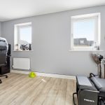 Home office with guitar and gaming setup