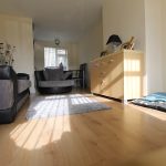 Cosy living room with sofa and wooden floor